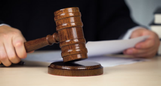 meeting chair banging a gavel on the block